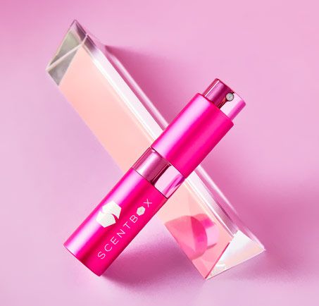 ScentBox monthly perfume subscription box contents with atomizer and case