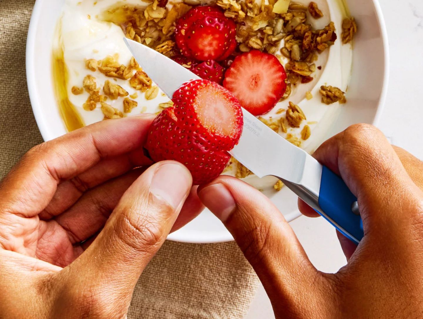 Misen 5-ply stainless steel skillet and Carbon Nonstick pan on dark kitchen counter — premium cookware product photography
